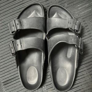 Black plastic Birkenstocks, size 38 / W size 7.